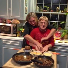 Alex and a family member cooking together